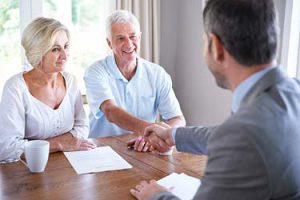 senior couple making contract agreement